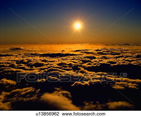 Sunset over clouds View Large Photo Image Stock Image - Sunset over clouds. Fotosearch