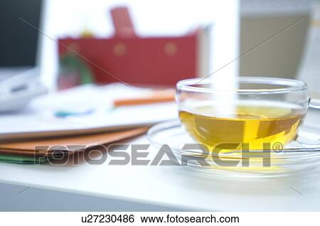 Stock Photograph - Tea cup on desk. Fotosearch