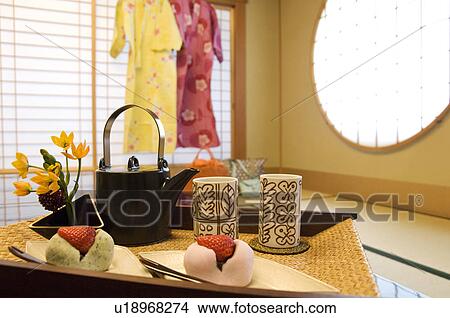 Teapot and rice cakes on table View Large Photo Image Picture - Teapot and rice cakes on table. Fotosearch
