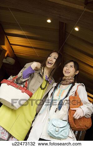 Two friends with travel bags View Large Photo Image Stock Image - Two friends with travel bags. Fotosearch