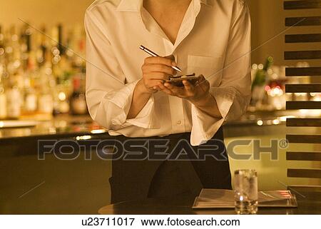 Stock Photo - Waiter taking a customer's order. Fotosearch