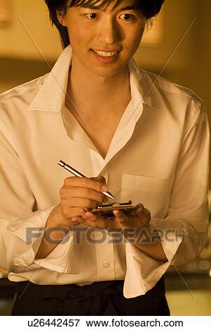 Stock Photo - Waiter taking a customer's order. Fotosearch