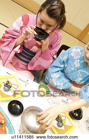 Woman dressed in a yukata and drinking miso soup View Large Photo Image Stock Photography - Woman dressed in a yukata and drinking miso soup. Fotosearch