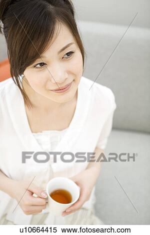 Stock Photography - Woman drinking tea. Fotosearch