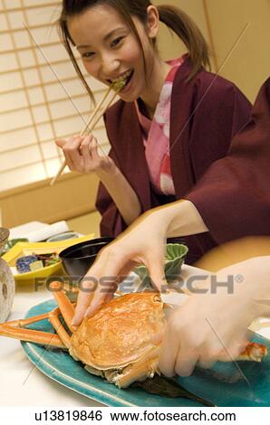 Woman in yukatas eating seafood View Large Photo Image Stock Photograph - Woman in yukatas eating seafood. Fotosearch