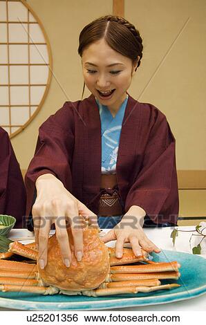 Woman in yukatas eating seafood View Large Photo Image Stock Photograph - Woman in yukatas eating seafood. Fotosearch
