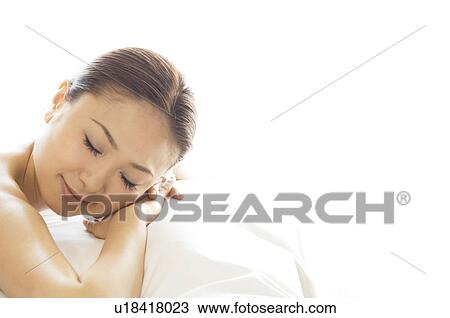 Woman lying on her stomach View Large Photo Image Stock Image - Woman lying on her stomach. Fotosearch