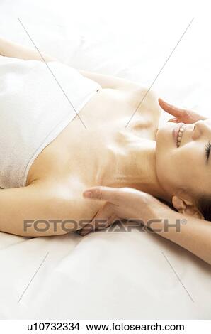 Picture - Woman receiving a massage. Fotosearch