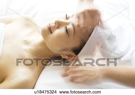 Picture - Woman receiving a massage. Fotosearch