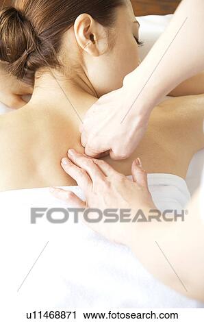 Woman receiving a massage View Large Photo Image Stock Image - Woman receiving a massage. Fotosearch