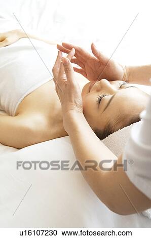 Woman receiving a massage View Large Photo Image Stock Image - Woman receiving a massage. Fotosearch