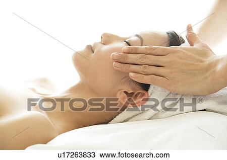 Woman receiving a massage View Large Photo Image Stock Image - Woman receiving a massage. Fotosearch