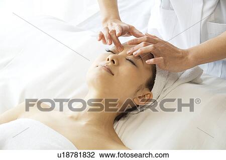 Woman receiving a massage View Large Photo Image Stock Image - Woman receiving a massage. Fotosearch