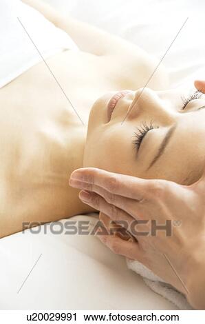 Stock Image - Woman receiving a massage. Fotosearch