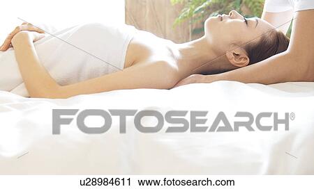 Stock Image - Woman receiving a massage. Fotosearch