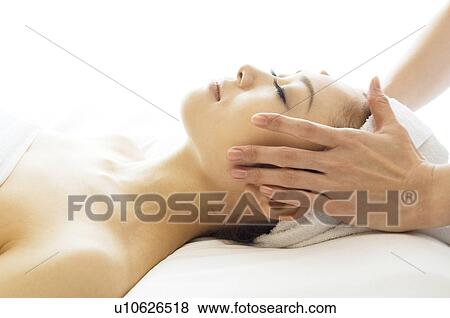 Stock Photo - Woman receiving a massage. Fotosearch