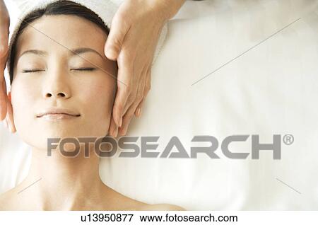 Stock Photo - Woman receiving a massage. Fotosearch
