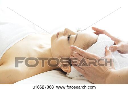 Stock Photo - Woman receiving a massage. Fotosearch