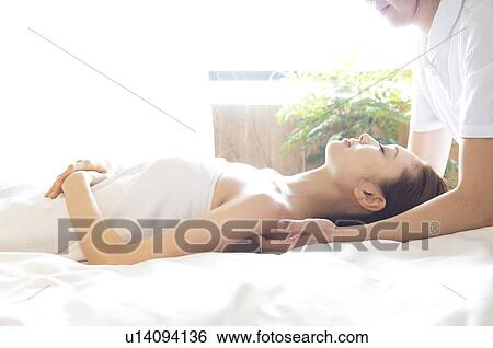 Woman receiving a massage View Large Photo Image Stock Photograph - Woman receiving a massage. Fotosearch