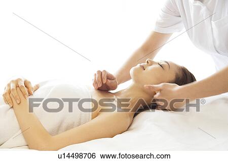 Woman receiving a massage View Large Photo Image Stock Photograph - Woman receiving a massage. Fotosearch