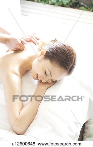 Woman receiving a massage View Large Photo Image Stock Photography - Woman receiving a massage. Fotosearch