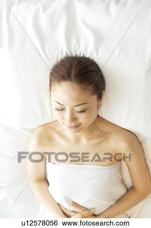 Woman relaxes after her massage View Large Photo Image Stock Photograph - Woman relaxes after her massage. Fotosearch