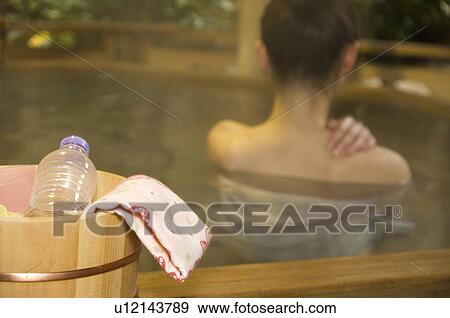 Woman relaxing in a hot tub View Large Photo Image Stock Photo - Woman relaxing in a hot tub. Fotosearch