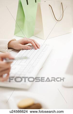 Woman shopping online View Large Photo Image Picture - Woman shopping online. Fotosearch