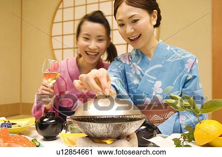 Women dressed in yukatas sitting down to eat a meal View Large Photo Image Stock Image - Women dressed in yukatas sitting down to eat a meal. Fotosearch