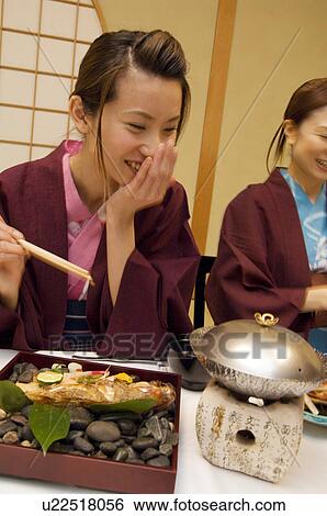 Women in yukatas eating seafood View Large Photo Image Stock Photograph - Women in yukatas eating seafood. Fotosearch