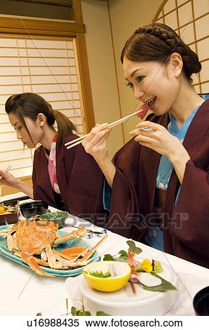 Women in yukatas eating seafood View Large Photo Image Stock Photography - Women in yukatas eating seafood. Fotosearch