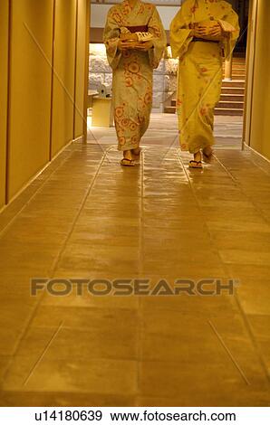Women wearing yukata walking down a hallway of a health spa carrying spa products in bamboo buckets View Large Photo Image Stock Photo - Women wearing yukata walking down a hallway of a health spa carrying spa products in bamboo buckets. Fotosearch