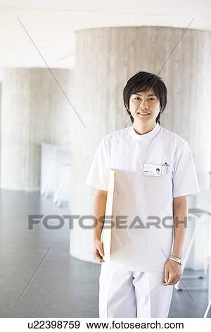 X-ray technician smiling at the camera View Large Photo Image Stock Photo - X-ray technician smiling at the camera. Fotosearch