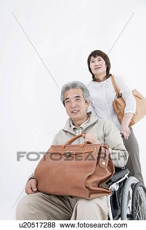 a car with a traveling bag -- the husband and wife of the senior of a chair View Large Photo Image Stock Photo - a car with a traveling bag -- the husband and wife of the senior of a chair. Fotosearch