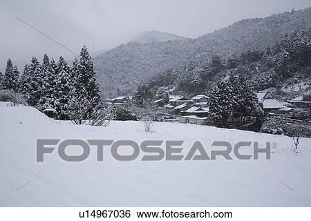Stock Photograph - A snowy rural landscape. Fotosearch
