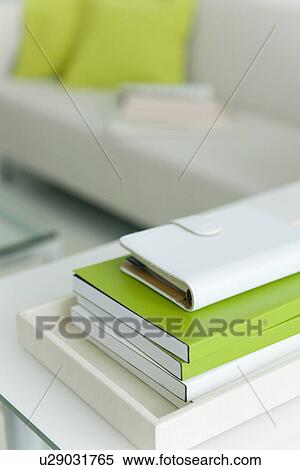 Stock Photography - Address book stacked in living room. Fotosearch