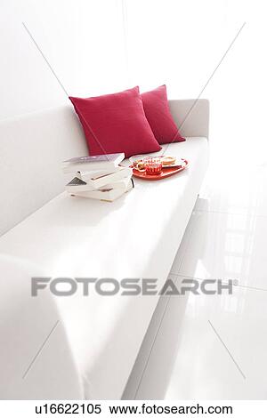 Stock Photography - Afternoon tea and books on a sofa. Fotosearch