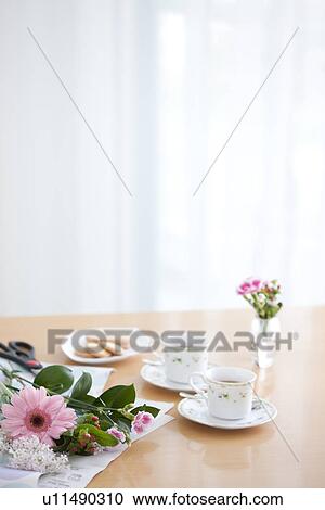 Afternoon tea and cookies on a living room table View Large Photo Image Stock Image - Afternoon tea and cookies on a living room table. Fotosearch