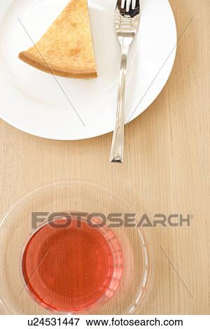 Stock Photo - Afternoon tea of cheesecake and herbal tea. Fotosearch