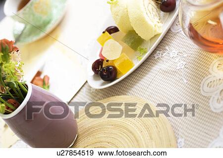 Stock Photo - Afternoon tea on table setting. Fotosearch