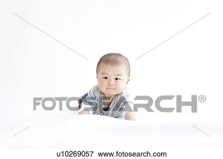 Baby on a blanket View Large Photo Image Stock Photo - Baby on a blanket. Fotosearch