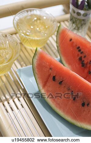 Barley tea and slices of watermelon View Large Photo Image Stock Image - Barley tea and slices of watermelon. Fotosearch