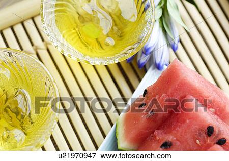 Stock Photo - Barley tea and slices of watermelon. Fotosearch