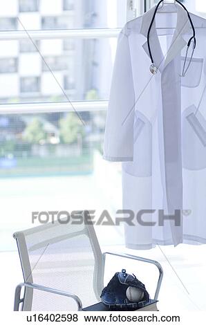 Stock Photo - Baseball glove and ball in doctor's office. Fotosearch