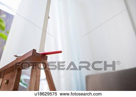 Stock Photography - Blank canvas on an easel. Fotosearch
