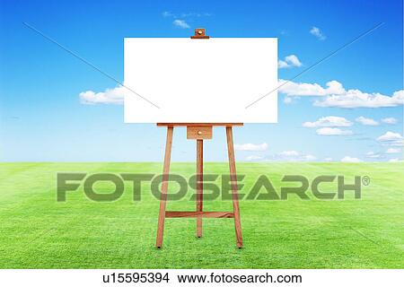 Picture - Blank easel on a lawn. Fotosearch