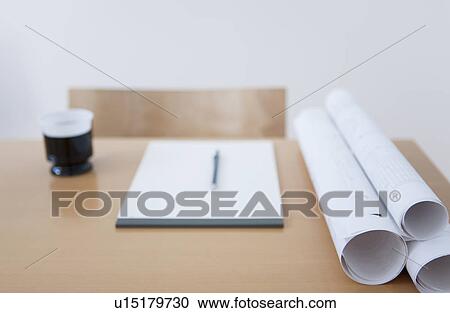 Blueprints and coffee cup on vacant desk View Large Photo Image Stock Image - Blueprints and coffee cup on vacant desk. Fotosearch