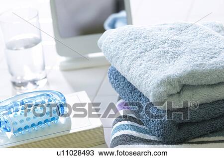 Book, towels, and a massaging tool View Large Photo Image Stock Image - Book, towels, and a massaging tool. Fotosearch