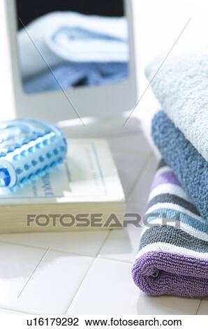 Book, towels, and a massaging tool View Large Photo Image Stock Image - Book, towels, and a massaging tool. Fotosearch