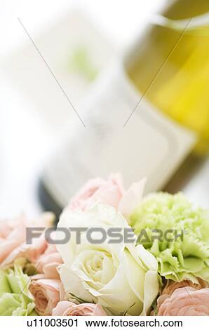 Bouquet and wine bottle View Large Photo Image Stock Image - Bouquet and wine bottle. Fotosearch